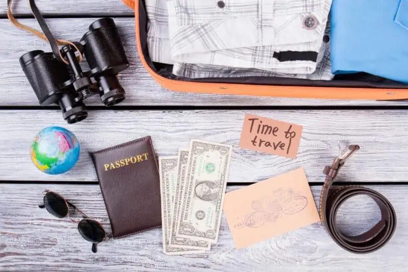 Packed suitcase and travel documents
