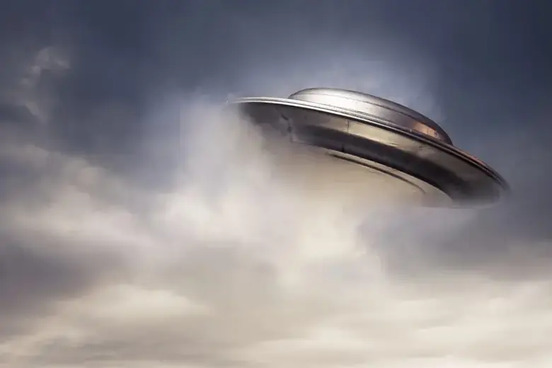 A UFO emerging from thick clouds