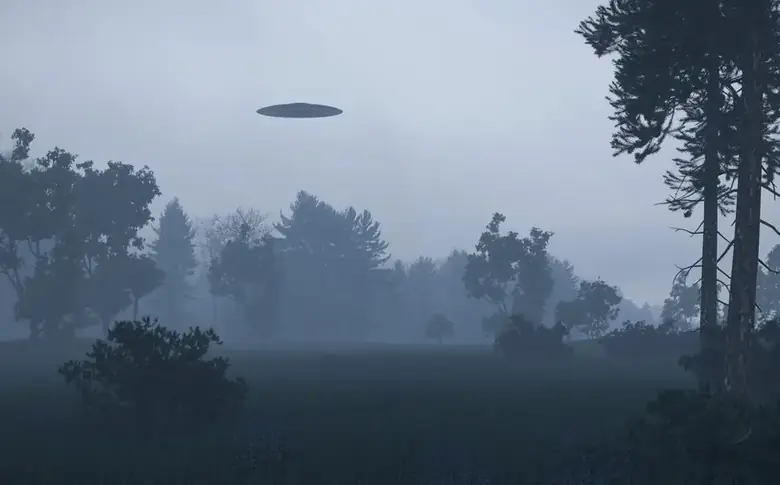 A UFO hovering over a misty forest